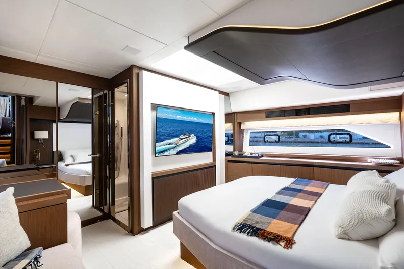  Yacht Photos Pics Luxurious interior of 2022 Prestige X70 yacht with modern bedroom and ocean view.