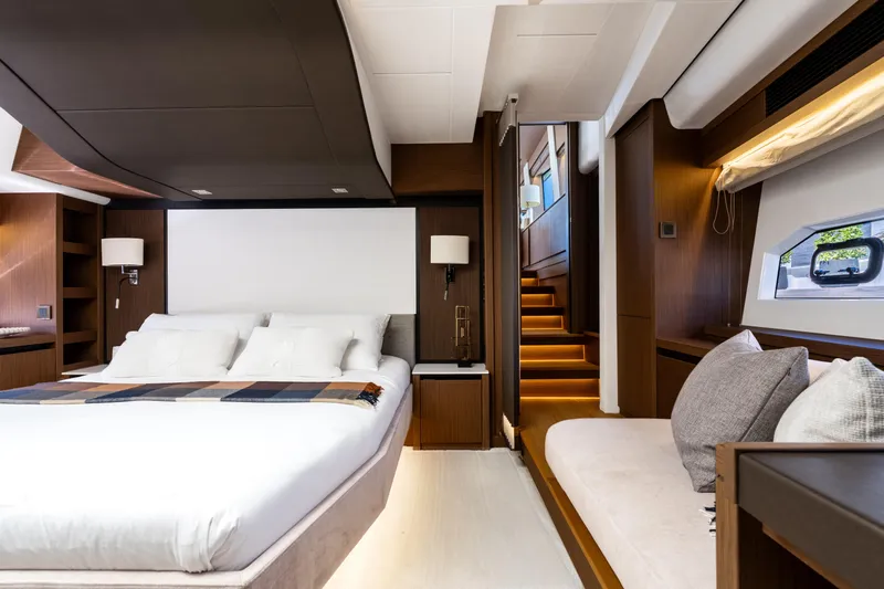  Yacht Photos Pics Luxurious 2022 Prestige X70 yacht bedroom with modern design and elegant furnishings.