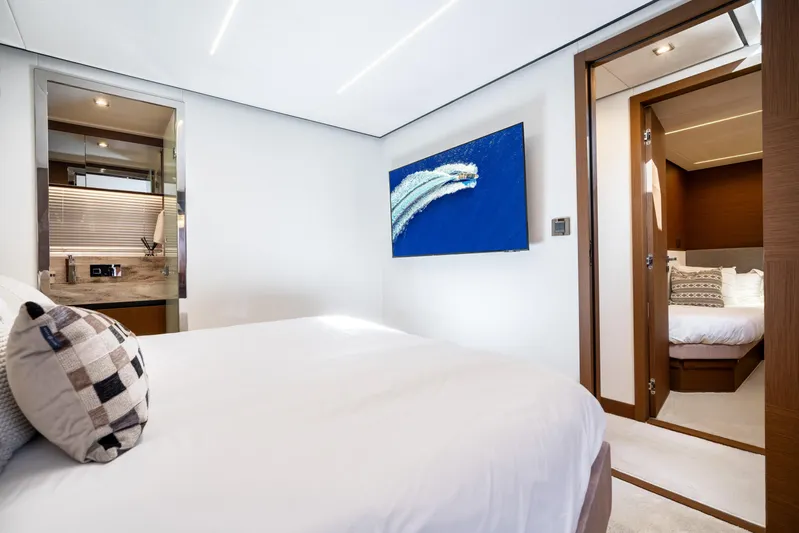  Yacht Photos Pics Luxurious 2022 Prestige X70 yacht bedroom with modern decor and elegant furnishings.