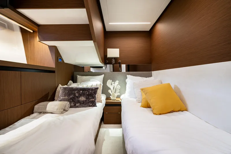  Yacht Photos Pics Luxurious 2022 Prestige X70 yacht cabin with twin beds and elegant decor.