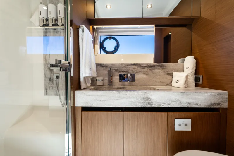  Yacht Photos Pics Luxurious bathroom in 2022 Prestige X70 yacht with modern fixtures and elegant design.