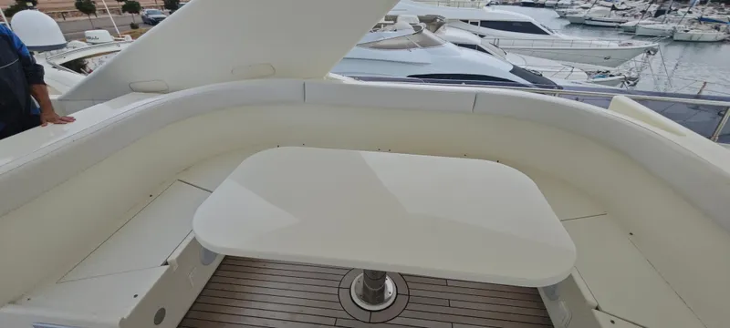  Yacht Photos Pics Luxurious seating area on 2009 Ferretti Yachts 830 with marina view.