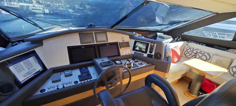  Yacht Photos Pics Cockpit of 2009 Ferretti Yachts 830 with modern navigation equipment and seating area.