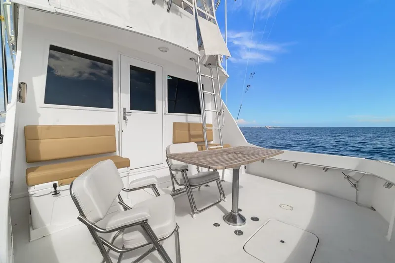 Bella Yacht Photos Pics 1978 Hatteras 45 Convertible yacht deck with seating and ocean view.