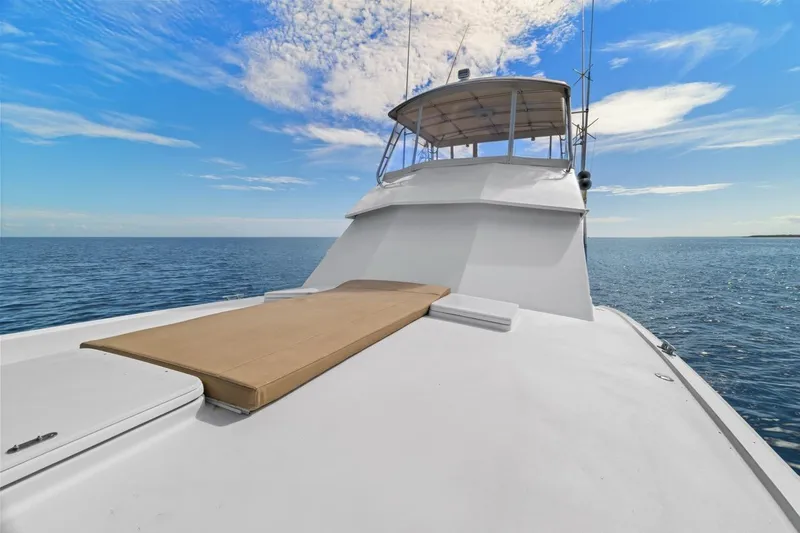 Bella Yacht Photos Pics 1978 Hatteras 45 Convertible yacht on open sea under blue sky.