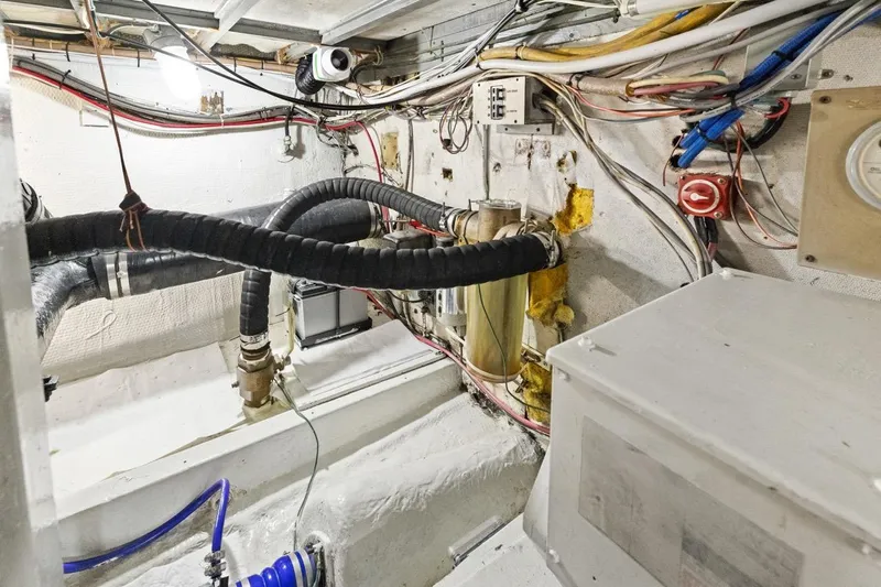 Bella Yacht Photos Pics Engine room of 1978 Hatteras 45 Convertible with wiring and plumbing details.