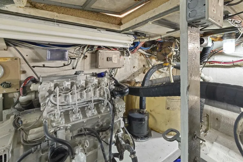 Bella Yacht Photos Pics Engine room of 1978 Hatteras 45 Convertible boat, showcasing mechanical components and wiring.