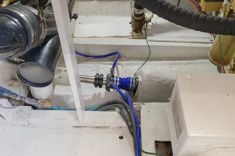 Bella Yacht Photos Pics Engine room of a 1978 Hatteras 45 Convertible boat, showing mechanical components.