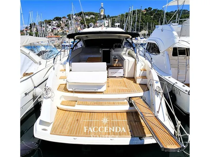  Yacht Photos Pics 2013 Azimut Atlantis 44 yacht docked at marina, featuring spacious deck and luxurious design.