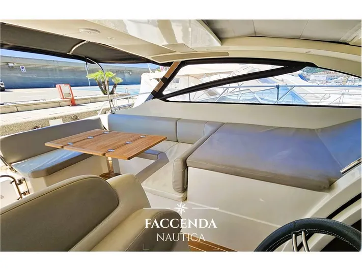  Yacht Photos Pics Interior of 2013 Azimut Atlantis 44 yacht with seating and table.