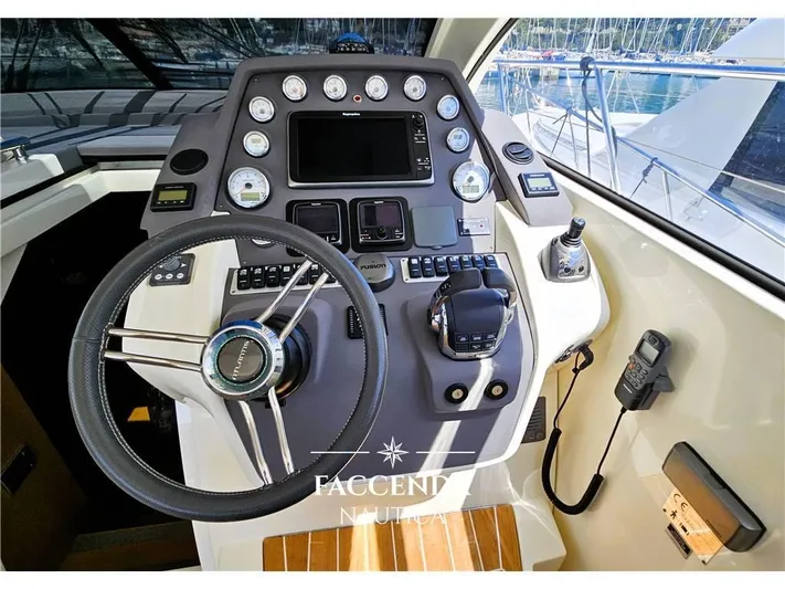 Yacht Photos Pics Cockpit of 2013 Azimut Atlantis 44 yacht with steering wheel and control panel.