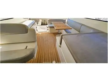  Yacht Photos Pics Interior of 2013 Azimut Atlantis 44 yacht with wooden flooring and cushioned seating.