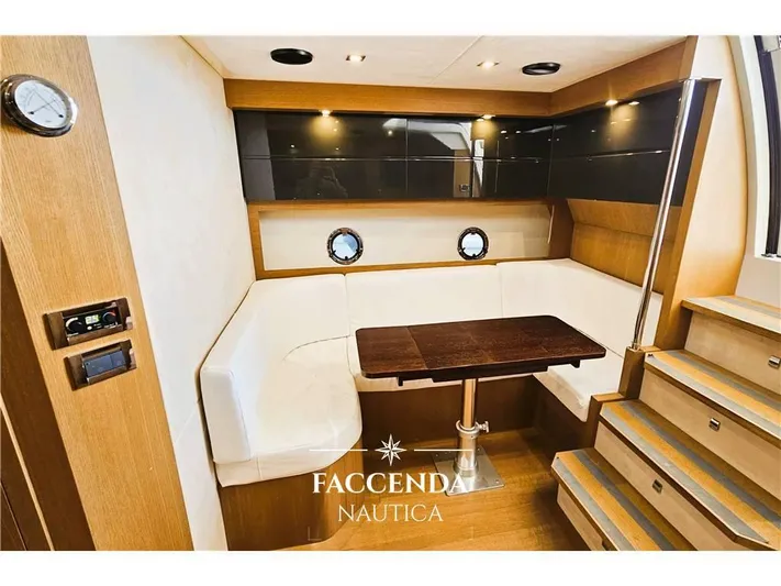  Yacht Photos Pics Interior of 2013 Azimut Atlantis 44 yacht with elegant seating and wooden table.