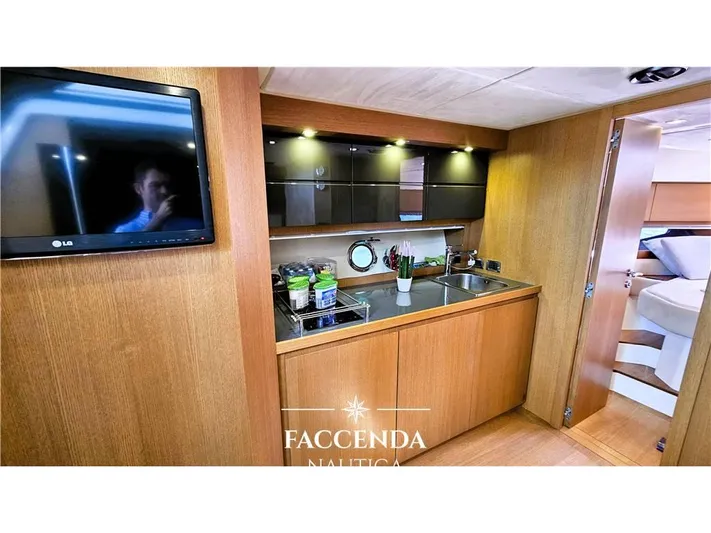  Yacht Photos Pics Interior of 2013 Azimut Atlantis 44 yacht with modern kitchen and TV.
