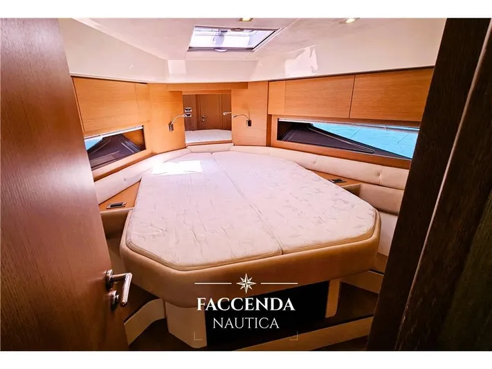  Yacht Photos Pics Luxurious cabin interior of 2013 Azimut Atlantis 44 yacht with elegant bedding.