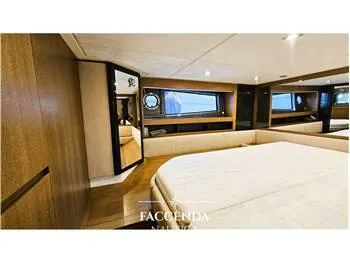  Yacht Photos Pics Luxurious interior of 2013 Azimut Atlantis 44 yacht with elegant wood finishes and large windows.