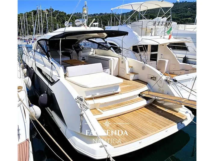  Yacht Photos Pics 2013 Azimut Atlantis 44 yacht docked at marina, featuring sleek design and spacious deck.