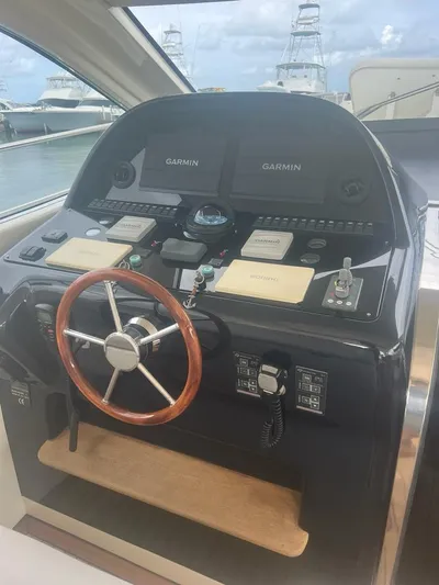 Side Effeot Yacht Photos Pics Helm of 2007 Uniesse 54 Sport yacht with Garmin navigation systems.