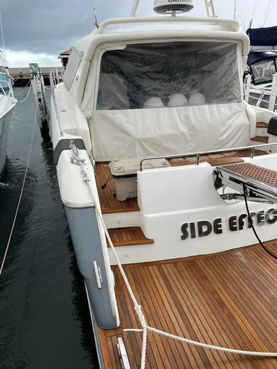 Side Effeot Yacht Photos Pics 2007 Uniesse 54 Sport yacht docked at marina with teak deck.