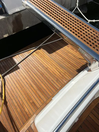 Side Effeot Yacht Photos Pics Teak deck of a 2007 Uniesse 54 Sport yacht at the dock.