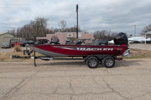 2025 Tracker Pro Team 195 Tournament Edition boat on trailer, parked outdoors.