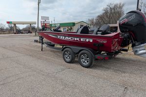 2025 Tracker Pro Team 195 Tournament Edition boat on trailer in parking lot.