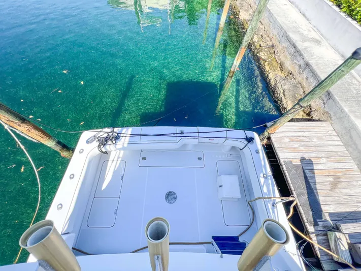 Goggle Eye Yacht Photos Pics 2000 Luhrs 400 Convertible boat docked at a clear water marina.