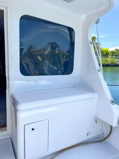 Goggle Eye Yacht Photos Pics 2000 Luhrs 400 Convertible boat interior with window and storage compartment.