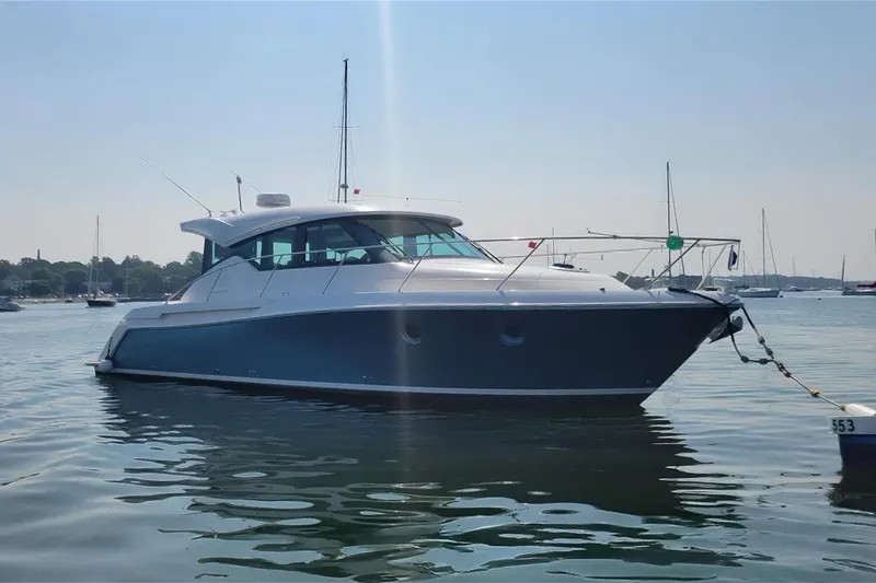 Silver Lining Yacht Photos Pics 2017 Tiara Yachts C39 Coupe anchored on calm water, side view.