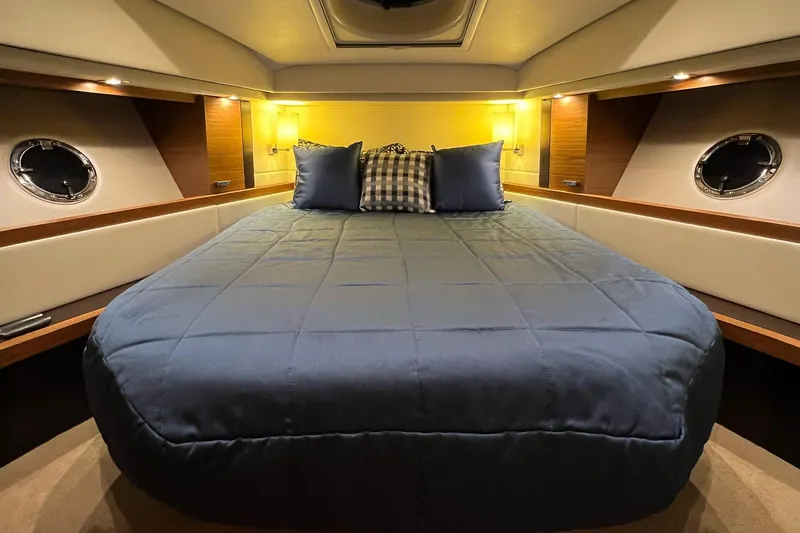 Silver Lining Yacht Photos Pics Luxurious cabin interior of 2017 Tiara Yachts C39 Coupe with cozy bedding.