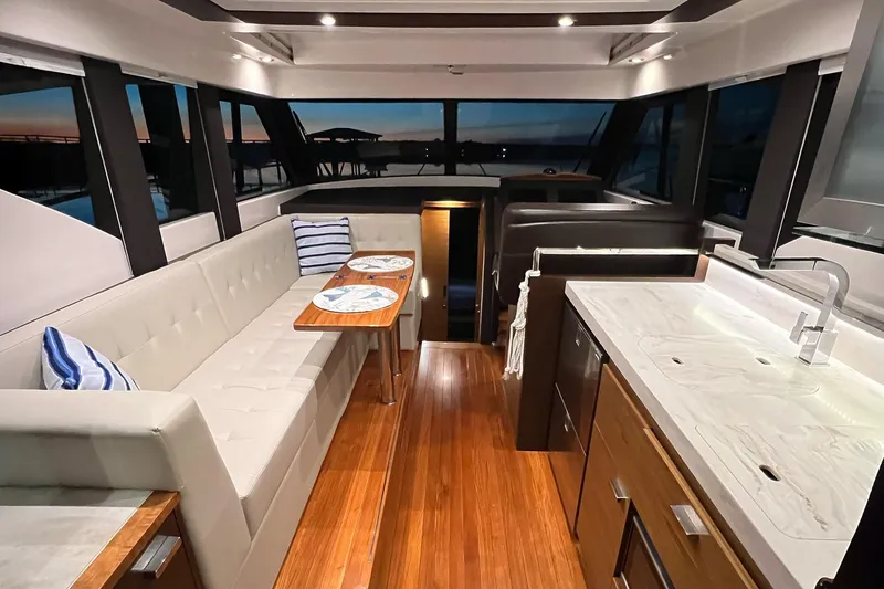 Silver Lining Yacht Photos Pics Luxurious interior of 2017 Tiara Yachts C39 Coupe with elegant seating and modern kitchen.
