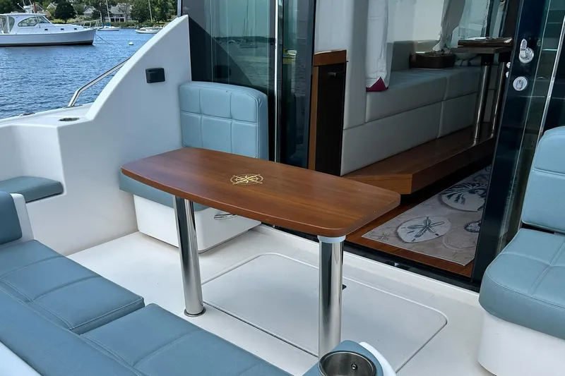 Silver Lining Yacht Photos Pics 2017 Tiara Yachts C39 Coupe interior with elegant seating and wooden table.