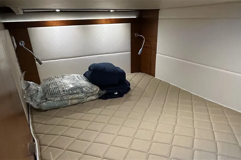 Silver Lining Yacht Photos Pics 2017 Tiara Yachts C39 Coupe cabin with beige quilted bedding and reading lights.
