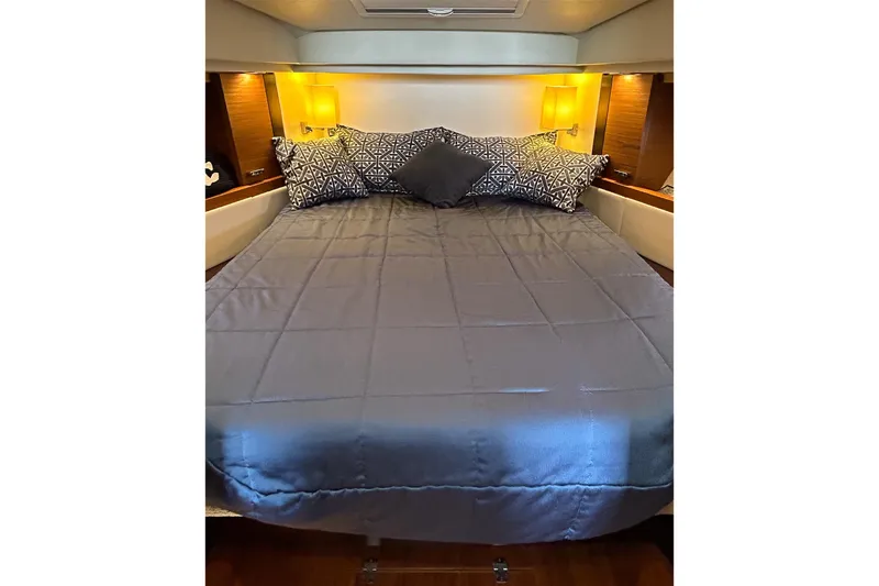Silver Lining Yacht Photos Pics Luxurious bedroom interior of 2017 Tiara Yachts C39 Coupe with elegant bedding.