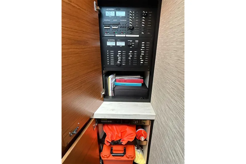 Silver Lining Yacht Photos Pics 2017 Tiara Yachts C39 Coupe electrical panel and storage cabinet interior.