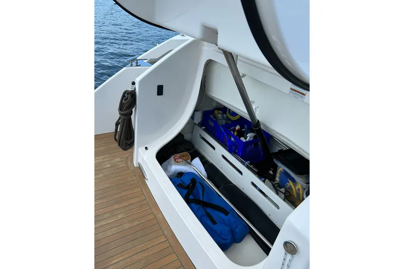 Silver Lining Yacht Photos Pics Storage compartment on 2017 Tiara Yachts C39 Coupe, featuring organized boating essentials.
