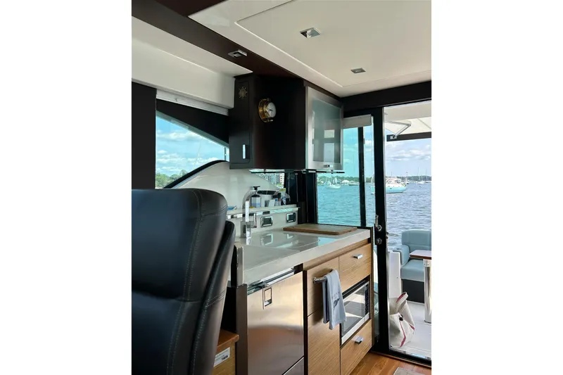 Silver Lining Yacht Photos Pics Interior of 2017 Tiara Yachts C39 Coupe, featuring modern kitchen and scenic water view.