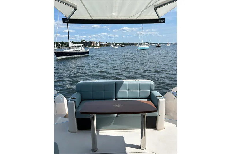 Silver Lining Yacht Photos Pics 2017 Tiara Yachts C39 Coupe with seating area overlooking a scenic marina.