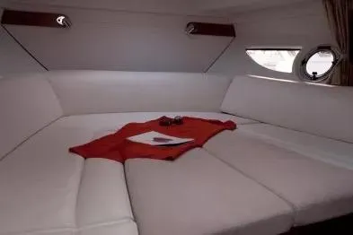 Yacht Photos Pics 2013 Beneteau Flyer GT 34 interior with white seating and red accents.