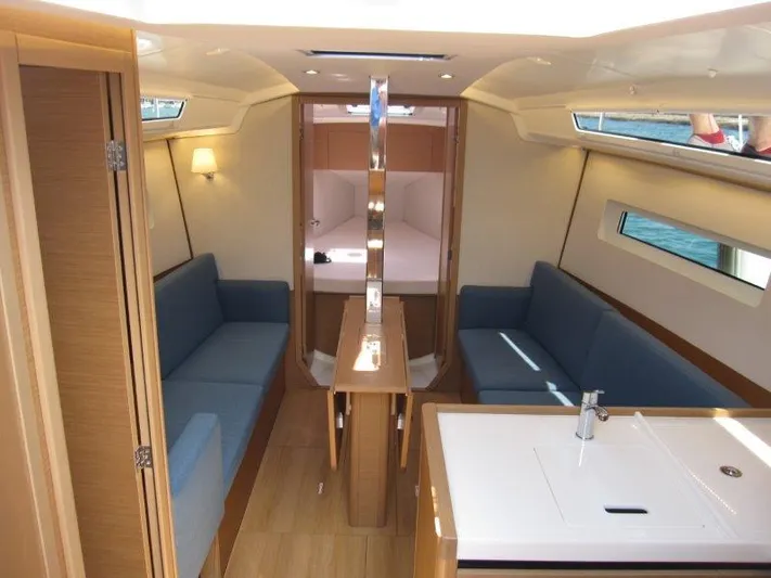  Yacht Photos Pics Interior of 2025 Jeanneau Sun Odyssey 350 yacht, featuring modern seating and sleek design.