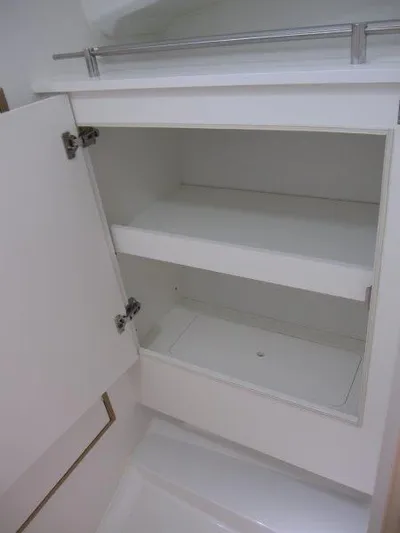  Yacht Photos Pics 2025 Jeanneau Sun Odyssey 350 interior cabinet with open shelves and sleek design.