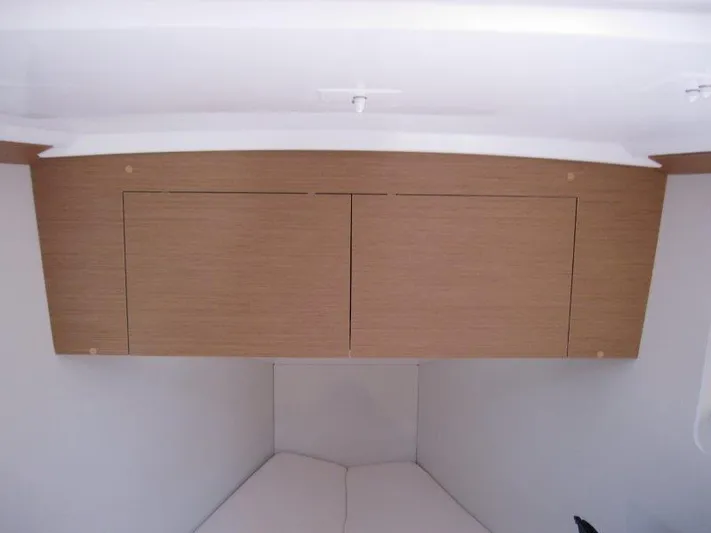  Yacht Photos Pics Interior cabin storage of 2025 Jeanneau Sun Odyssey 350 sailboat.