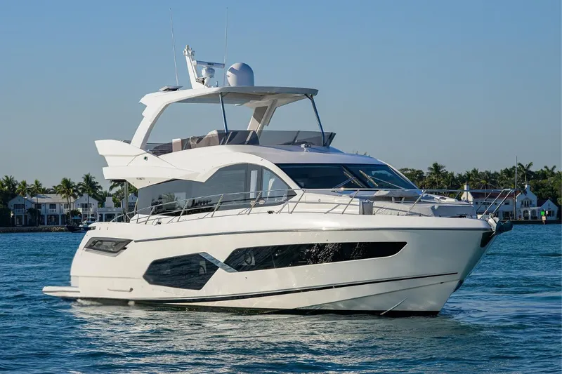 Lucky Ladies Yacht Photos Pics 2022 Sunseeker Manhattan 68 yacht cruising on a sunny day.