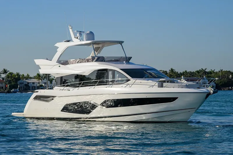 Lucky Ladies Yacht Photos Pics 2022 Sunseeker Manhattan 68 yacht cruising on a sunny day.