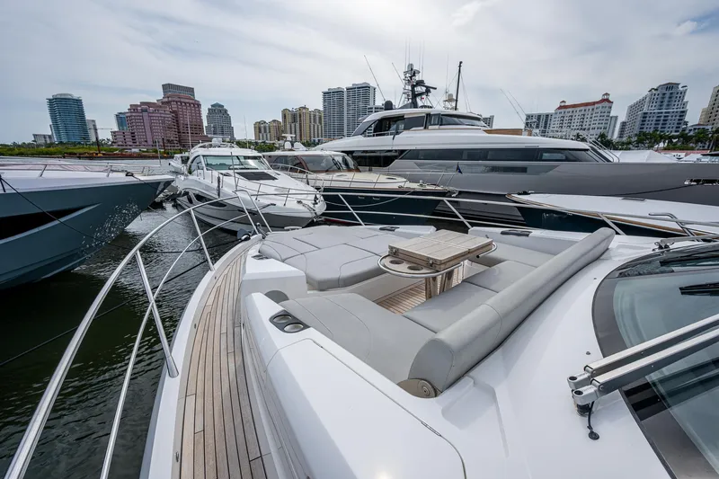 Lucky Ladies Yacht Photos Pics Sunseeker Manhattan 68 yacht, 2022 model, docked with city skyline in background.
