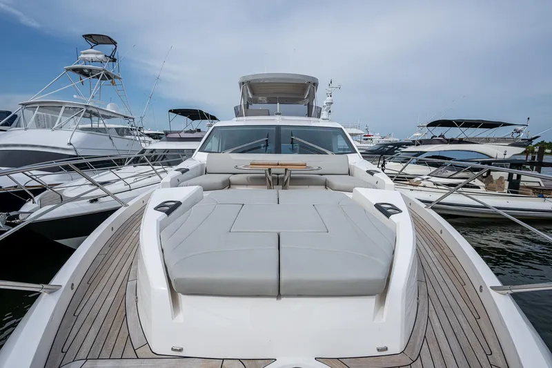 Lucky Ladies Yacht Photos Pics Sunseeker Manhattan 68 yacht, 2022 model, docked with spacious deck and luxurious seating.