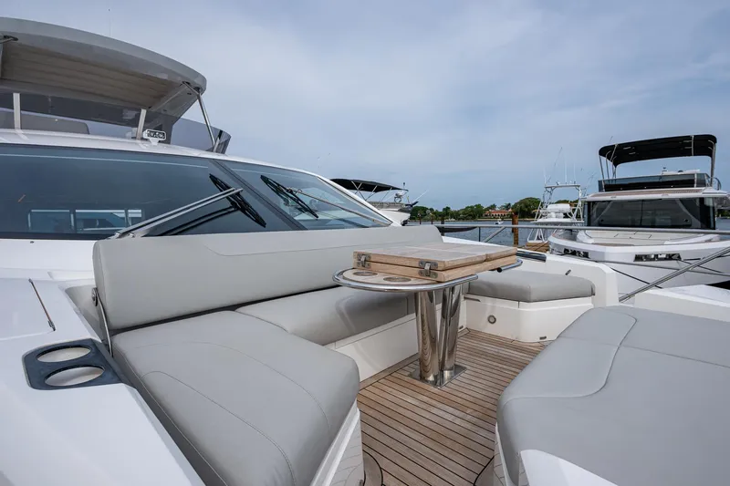 Lucky Ladies Yacht Photos Pics 2022 Sunseeker Manhattan 68 yacht with sleek seating and elegant deck design.