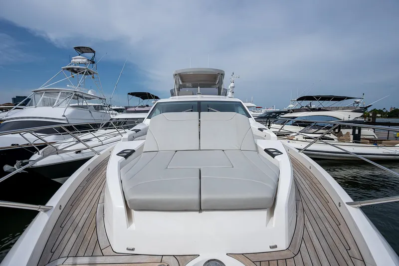 Lucky Ladies Yacht Photos Pics Sunseeker Manhattan 68 yacht, 2022 model, docked with sleek design and spacious deck.