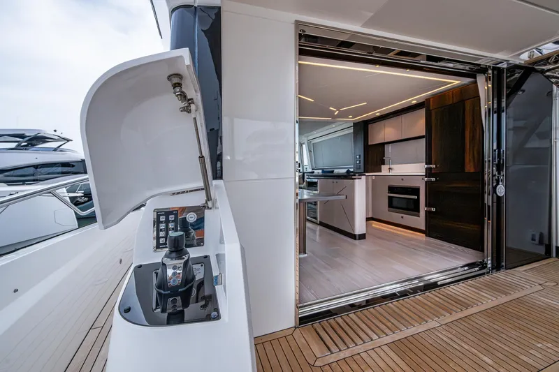 Lucky Ladies Yacht Photos Pics Luxurious interior of 2022 Sunseeker Manhattan 68 yacht with modern kitchen design.
