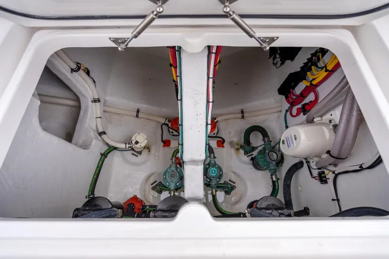  Yacht Photos Pics 2024 Intrepid 477 Evolution engine compartment with visible wiring and plumbing systems.